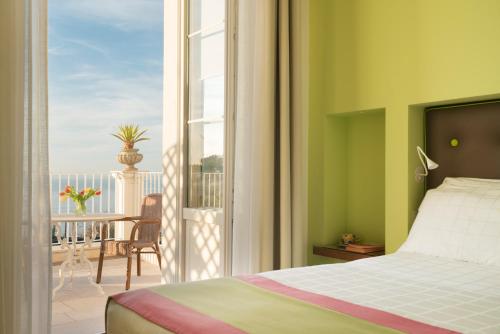 Ένα ή περισσότερα κρεβάτια σε δωμάτιο στο Relais Palazzo del Barone