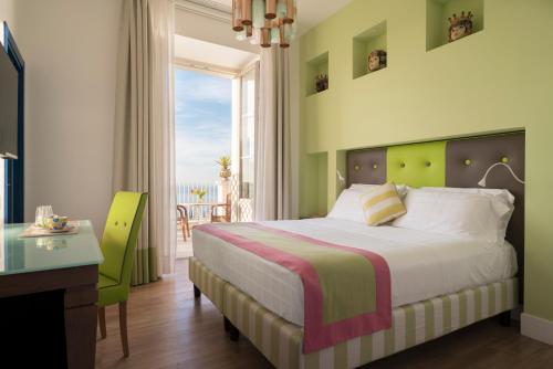 Ένα ή περισσότερα κρεβάτια σε δωμάτιο στο Relais Palazzo del Barone