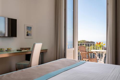 Ένα ή περισσότερα κρεβάτια σε δωμάτιο στο Relais Palazzo del Barone