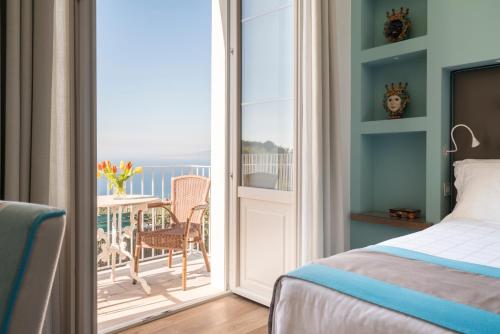 Postel nebo postele na pokoji v ubytování Relais Palazzo del Barone