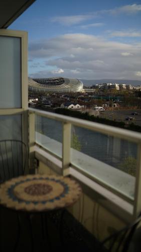 a balcony with a table and a view of a stadium at The Fitz Apartment in Dublin
