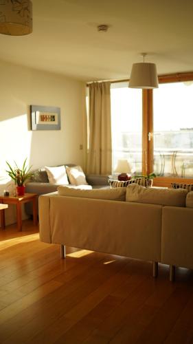 a living room with two couches and a couch at The Fitz Apartment in Dublin