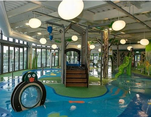 a water park with a pool and a play area at Lakeside Dorchester Lodge - Hot Tub with Fishing Peg in Tattershall