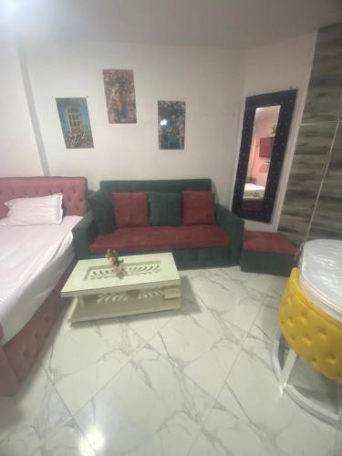 a living room with a couch and a table at Porto said in Port Said