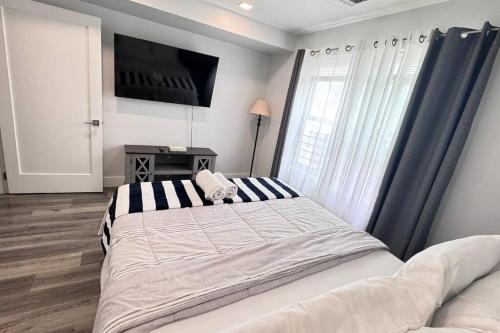 Ένα ή περισσότερα κρεβάτια σε δωμάτιο στο The Cozy Suite - 1BR with Free Parking