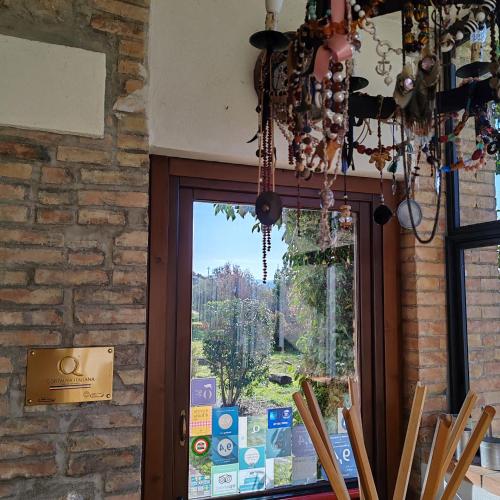 a glass door to a window with a view at Taverna Centomani in Potenza