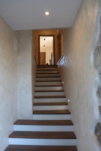 a set of stairs in a building at Rustikalna soba sa kupaonicom Milena in Kaldir