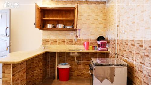 a small kitchen with a counter and a sink at Halla Matrouh Sea View in Marsa Matruh
