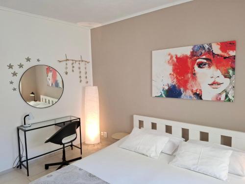 a bedroom with a white bed and a mirror at Apartment Sandy in Hvar