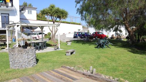 a park with cars parked next to a building at Il giardino di Mary in Pompei