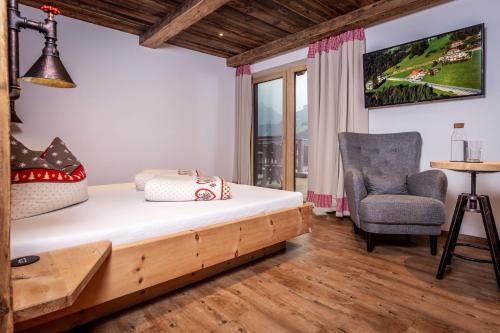 Ein Bett oder Betten in einem Zimmer der Unterkunft Alpen Chalet Wohnung "Martha"