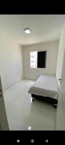 เตียงในห้องที่ Apartamento Aconchego condomínio florida