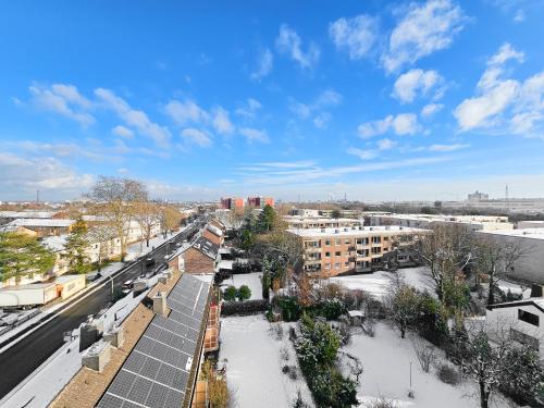 a view of a city with snow and buildings at Tolstov Apartments - 1 or 3 Room Apartments with Balcony - 20 Min Messe DUS & Airport DUS in Meerbusch