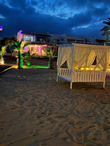 a couple of beds on the beach at night at The Best Apartment on the beach 'Caesar Beach' Bogaz, North Cyprus in Boğaz