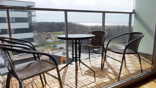 Un balcón o terraza en SEA VIEW APARTEMENT