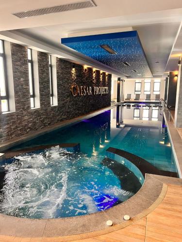 a swimming pool in the middle of a building at The Best Apartment on the beach 'Caesar Beach' Bogaz, North Cyprus in Boğaz