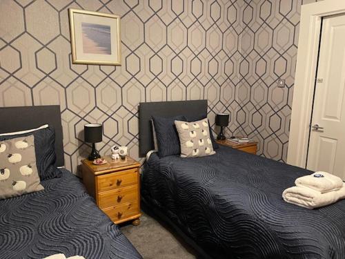 Ένα ή περισσότερα κρεβάτια σε δωμάτιο στο Dionard Guest House