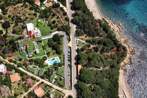 an aerial view of a house next to the ocean at Lanthia Resort in Santa Maria Navarrese