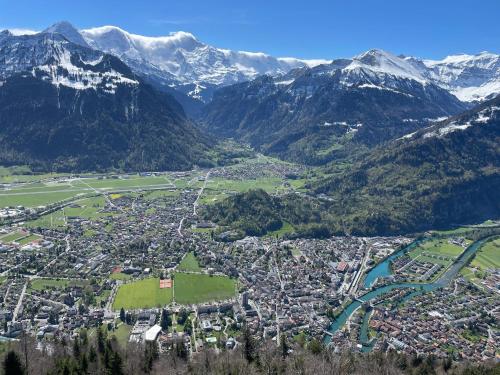 an aerial view of a town in the mountains at Bellevue Apartment in Ringgenberg
