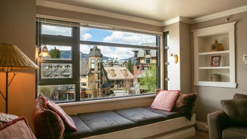 a window seat with a view of a city at Carleton Lodge in Whistler