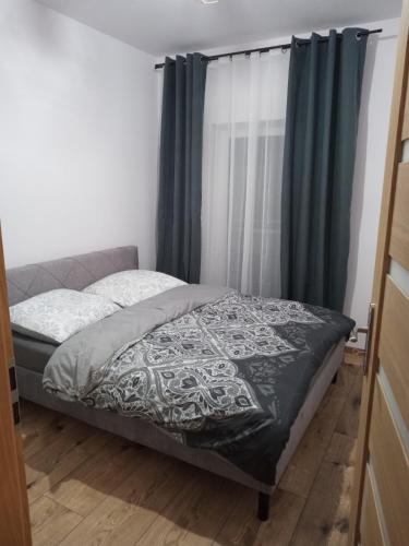 Ліжко або ліжка в номері Apartament Tykocin