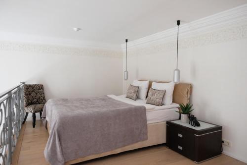 En eller flere senge i et værelse på Tallinn City Apartments Luxury Loft