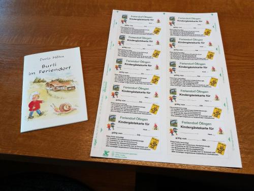 two pages of a menu on a table at Villa Leni im Schwarzwald in Bad Dürrheim
