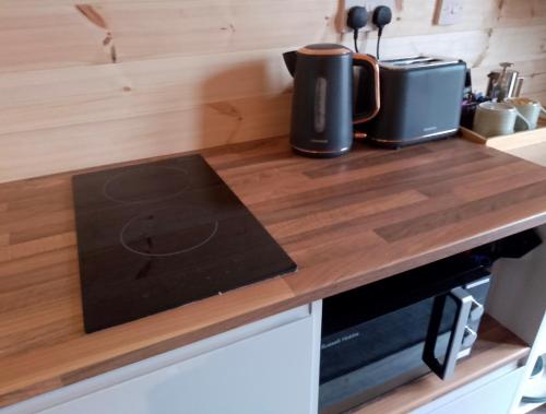 a kitchen with a counter top with a coffee pot on it at Faodail 'a lucky find' in Dunbeath