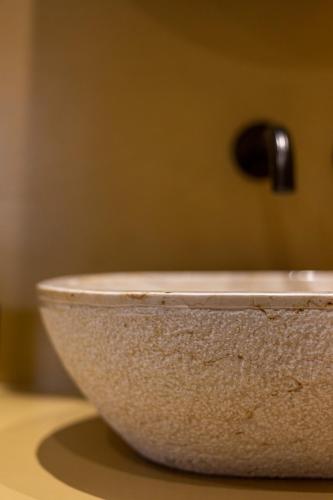 a bowl sitting on top of a table at God's View Tower - Pyrgos Towers Complex in Pírgos