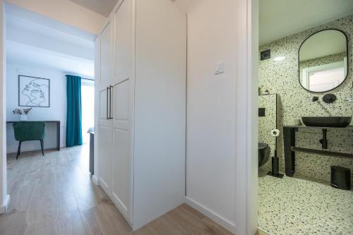 a bathroom with a sink and a mirror at Villa Fran, Krk in Sveti Vid-Miholjice