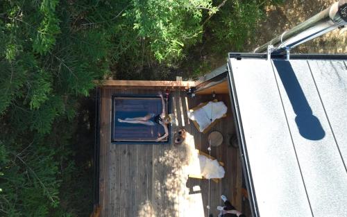 a person sticking their head out of a window in a trailer at Chili Shale in Yablunytsya