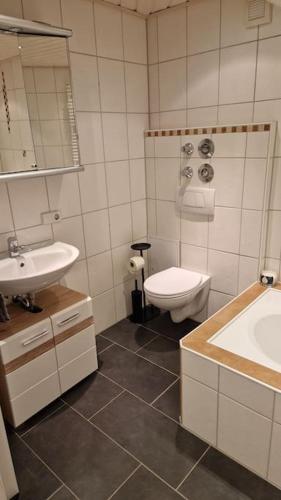 a bathroom with a toilet and a sink at 'Allgäus Finest Place '-Domizil zum Träumen und Erholen in Leutkirch im Allgäu