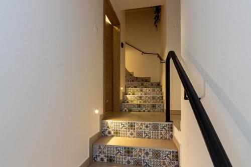 a staircase with tiled floors and a stair case at House Feral (Vis center) in Vis
