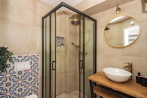 a bathroom with a shower and a sink and a mirror at House Feral (Vis center) in Vis