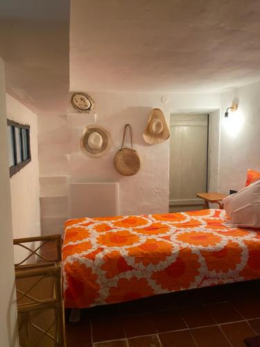 a bedroom with a bed and a clock on the wall at LOFT AUTHENTIQUE 3 STARS Terrasse VIEUX PORT in La Ciotat