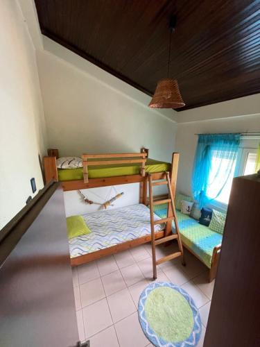 a bedroom with two bunk beds and a rug at Hope's House in Platanitis
