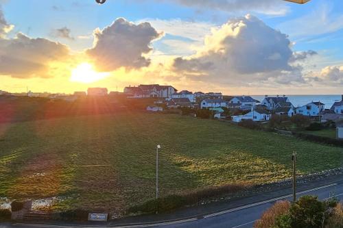 a view of the sunset from the balcony of a house at Morlun, Trearddur Bay, Isle of Anglesey in Trearddur