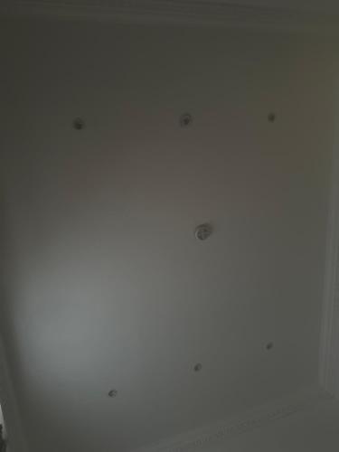 a white ceiling with four holes in it at No stress in Trumpington