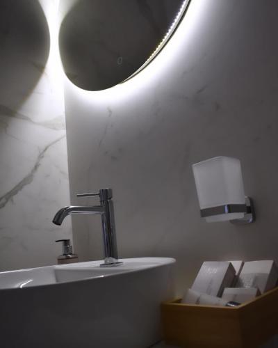 a bathroom with a sink and a mirror at Cielo B&B in Crotone