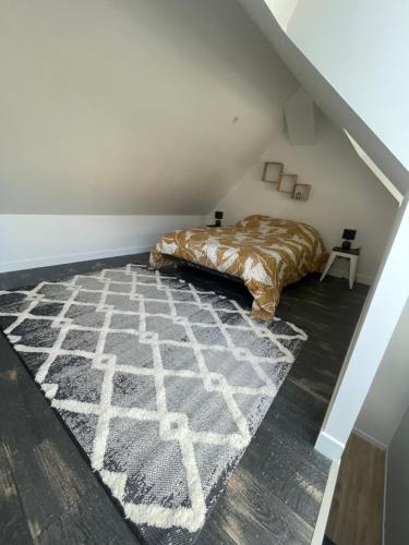 Letto o letti in una camera di L'ATELIER YPORT