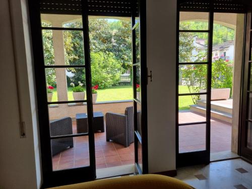 an open door with a view of a patio at MareMonti Borghetto in Borghetto di Vara