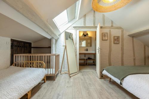 Posteľ alebo postele v izbe v ubytovaní Le Cottage de Chitenay