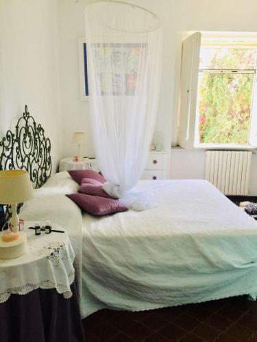 a bedroom with two beds and a window at Villa Rachele in Procida