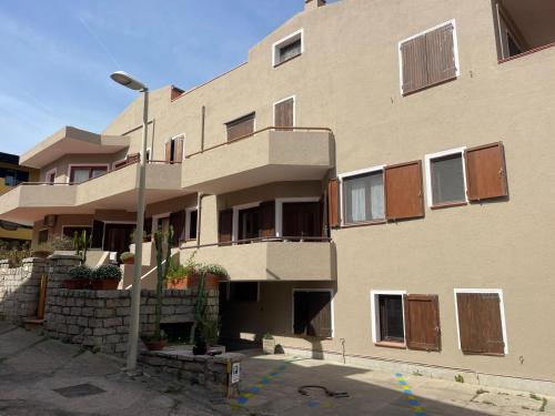 a building with a street light in front of it at Casa Fiorella - Vista Mare in Palau