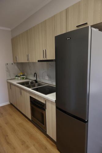 AMEL Deluxe Apartment tesisinde mutfak veya mini mutfak