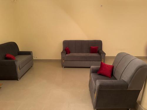 a living room with two chairs and a couch at Alpha house in Ndangane