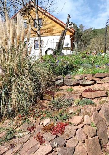a stone path leading to a house with a building at Beas Ferienglück in Busenberg