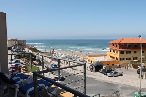 a view of a beach and the ocean from a balcony at Apartment with Breathtaking view in Praia da Areia Branca