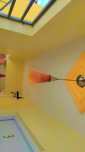 a wooden spoon hanging from the ceiling of a room at Hotel La Barrica in SJM