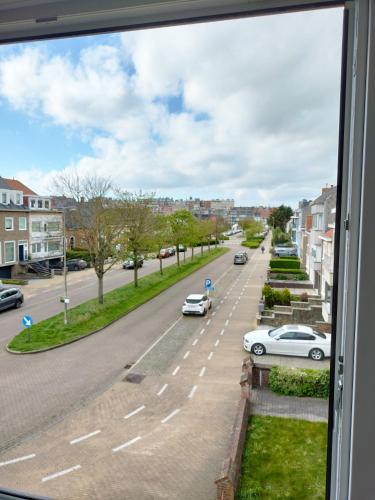 a view from a window of a street with cars at Project 9 in Ostend